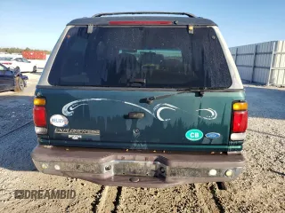 1997 Ford Explorer XL with VIN 1FMDU34E5VZB40878, listed as a Copart auction lot 84009744 with 185,047 mi miles and Salvage title. Bid and sale history available at DreamBid. Image 6.