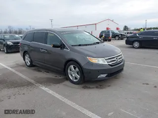 2011 Honda Odyssey Touring with VIN 5FNRL5H90BB045104, listed as a IAAI auction lot 41702541 with 226,510 mi miles. Bid and sale history available at carsss.com. Image 1.