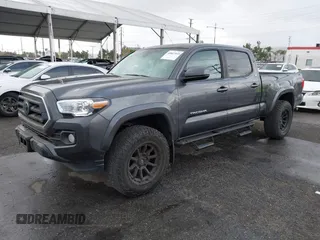 2022 Toyota Tacoma SR5 with VIN 3TMBZ5DN2NM034561, listed as a IAAI auction lot 40867443 with 51,728 mi miles and . Bid and sale history available at DreamBid. Image 2.