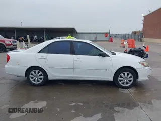 2003 Toyota Camry LE z VIN JTDBF30K530148403, wystawiony jako IAAI lot #41688346 z przebiegiem 299 143 mil mil oraz . Historia ofert i sprzedaży dostępna na DreamBid. Obrazek 13.