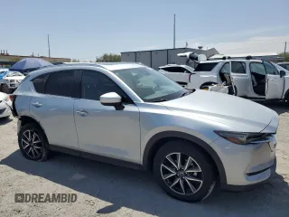 2018 Mazda CX-5 Grand Touring with VIN JM3KFBDM0J0377243, listed as a Copart auction lot 62199295 with 37,930 mi miles and Salvage title. Bid and sale history available at DreamBid. Image 4.