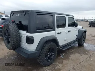 2021 Jeep Wrangler Unlimited Sport S with VIN 1C4HJXDG8MW509322, listed as a IAAI auction lot 42110123 with 39,955 mi miles and . Bid and sale history available at DreamBid. Image 4.