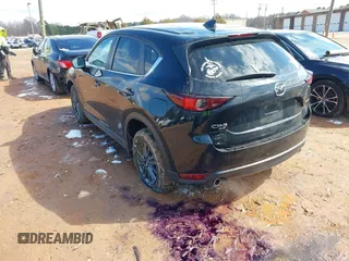2020 Mazda CX-5 Touring z VIN JM3KFBCMXL1741182, wystawiony jako IAAI lot #41602315 z przebiegiem 31 582 mil mil oraz . Historia ofert i sprzedaży dostępna na DreamBid. Obrazek 3.