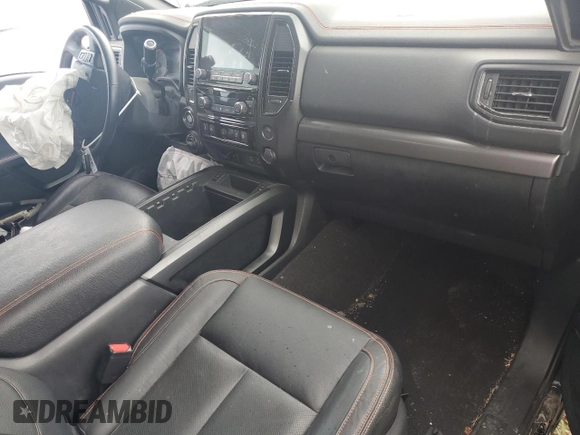 2021 Nissan Titan Pro-4X with VIN 1N6AA1ED0MN528002, listed as a Copart auction lot 54779885 with 33,235 mi miles and Salvage title. Bid and sale history available at DreamBid. Image 8.