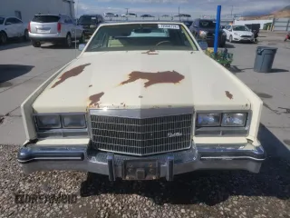 1984 Cadillac Eldorado z VIN 1G6AL578XEE621800, wystawiony jako Copart lot #72058714 z przebiegiem 50 757 mil mil oraz Tytuł czysty. Historia ofert i sprzedaży dostępna na DreamBid. Obrazek 5.