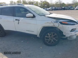 2015 Jeep Cherokee Latitude with VIN 1C4PJLCS6FW689607, listed as a IAAI auction lot 42103286 with 142,479 mi miles. Bid and sale history available at carsss.com. Image 6.