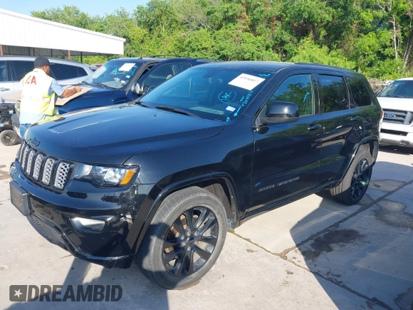 2017 Jeep Grand Cherokee Laredo with VIN 1C4RJFAGXHC817666, listed as a IAAI auction lot 42036817 with 119,698 mi miles. Bid and sale history available at carsss.com. Image 2.