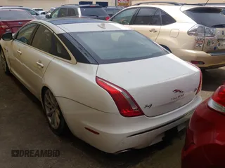 2013 Jaguar XJ with VIN SAJWJ1CD7D8V49599, listed as a Copart auction lot 54008915 with 133,163 mi miles and Clean Title. Bid and sale history available at DreamBid. Image 3.