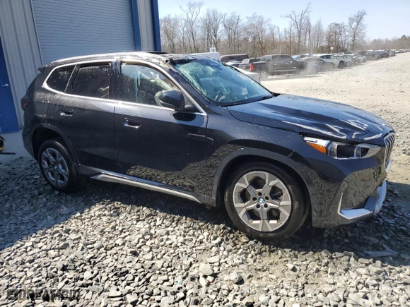 2025 BMW X1 xDrive28i with VIN WBX73EF00S5111795, listed as a Copart auction lot 48765255 with 12,042 mi miles and Salvage Title. Bid and sale history available at carsss.com. Image 4.