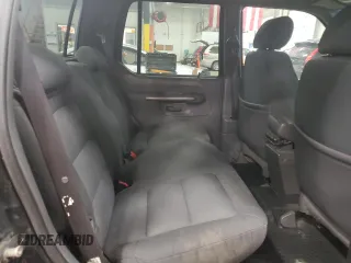2001 Ford Explorer Sport Trac z VIN 1FMZU77E01UA08076, wystawiony jako Copart lot #45813815 z przebiegiem 158 780 mil mil oraz Czysty tytuł • Clean title. Historia ofert i sprzedaży dostępna na DreamBid. Obrazek 10.