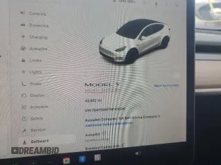 2022 Tesla Model Y Performance with VIN 7SAYGDEF1NF410241, listed as a Copart auction lot 45017155 with 42,652 mi miles and Salvage Title. Bid and sale history available at DreamBid. Image 9.