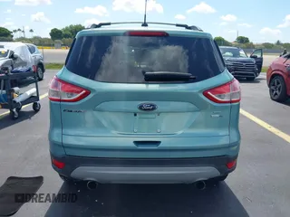 2013 Ford Escape SE with VIN 1FMCU9GX0DUC75662, listed as a IAAI auction lot 42549360 with 156,666 mi miles and . Bid and sale history available at DreamBid. Image 16.