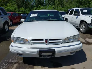 1993 Pontiac Bonneville SE z VIN 1G2HX53L8P1281104, wystawiony jako IAAI lot #42219547 z przebiegiem 113 292 mil mil oraz . Historia ofert i sprzedaży dostępna na DreamBid. Obrazek 12.