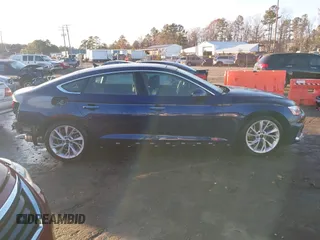 2023 Audi A5 Sportback Premium z VIN WAUABCF58PA032618, wystawiony jako IAAI lot #41048963 z przebiegiem 2 740 mil mil oraz . Historia ofert i sprzedaży dostępna na DreamBid. Obrazek 14.