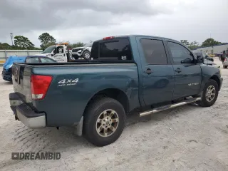 2006 Nissan Titan LE z VIN 1N6BA07B16N557411, wystawiony jako Copart lot #86058634 z przebiegiem 263 198 mil mil oraz Szkody całkowita. Historia ofert i sprzedaży dostępna na DreamBid. Obrazek 3.