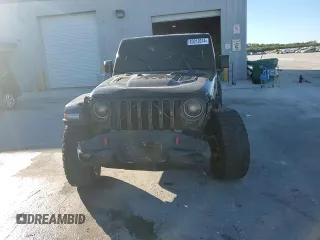 2020 Jeep Gladiator Rubicon z VIN 1C6JJTBG5LL101185, wystawiony jako Copart lot #83012014 z przebiegiem Nie podano mil oraz Nie do naprawy • Non repairable. Historia ofert i sprzedaży dostępna na DreamBid. Obrazek 11.