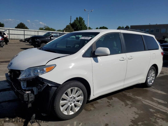 2015 Toyota Sienna LE with VIN 5TDJK3DC2FS126466, listed as a Copart auction lot 61165105 with 56,634 mi miles and Salvage title. Bid and sale history available at DreamBid. Image 1.