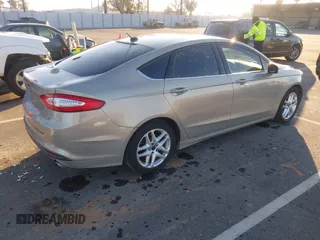 2015 Ford Fusion SE z VIN 3FA6P0H79FR137377, wystawiony jako IAAI lot #41345497 z przebiegiem 170 533 mil mil oraz . Historia ofert i sprzedaży dostępna na DreamBid. Obrazek 4.