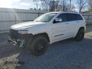 2015 Jeep Grand Cherokee Overland with VIN 1C4RJFCM3FC619141, listed as a Copart auction lot 47982825 with 117,887 mi miles and Salvage title. Bid and sale history available at DreamBid. Image 1.