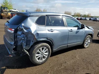 2022 Toyota Corolla Cross LE with VIN 7MUCAABGXNV025847, listed as a Copart auction lot 49153095 with 37,789 mi miles and Salvage title. Bid and sale history available at DreamBid. Image 3.
