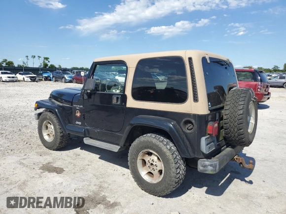 2001 Jeep Wrangler Sahara with VIN 1J4FA59S71P343366, listed as a Copart auction lot 57826405 with 156,436 mi miles and Salvage title. Bid and sale history available at DreamBid. Image 2.
