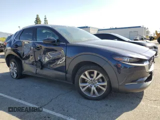 2020 Mazda CX-30 Premium with VIN 3MVDMAEM2LM134841, listed as a Copart auction lot 51979355 with 48,926 mi miles and Salvage title. Bid and sale history available at DreamBid. Image 4.