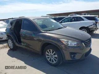 2016 Mazda CX-5 Touring with VIN JM3KE2CY0G0860828, listed as a IAAI auction lot 41666052 with 132,461 mi miles. Bid and sale history available at carsss.com. Image 1.
