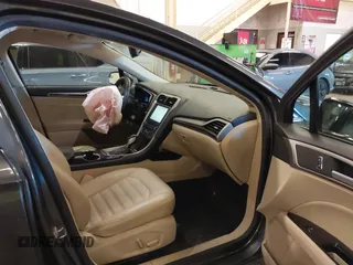 2016 Ford Fusion SE Hybrid with VIN 3FA6P0LU9GR235291, listed as a IAAI auction lot 41560312 with 112,777 mi miles. Bid and sale history available at carsss.com. Image 5.