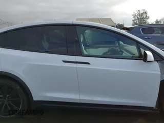 2023 Tesla Model X with VIN 7SAXCBE54PF384403, listed as a IAAI auction lot 40947187 with 16,881 mi miles and . Bid and sale history available at DreamBid. Image 14.