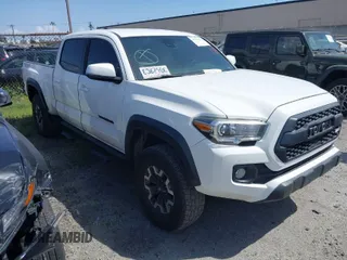 2021 Toyota Tacoma 4WD SR5 with VIN 3TMDZ5BN7MM103321, listed as a IAAI auction lot 41765512 with 49,009 mi miles. Bid and sale history available at carsss.com. Image 1.