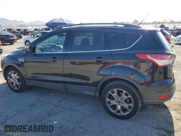 2013 Ford Escape SE with VIN 1FMCU0GX8DUA38056, listed as a Copart auction lot 57617885 with 128,467 mi miles and Salvage title. Bid and sale history available at DreamBid. Image 2.
