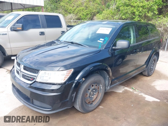 2014 Dodge Journey SE with VIN 3C4PDCABXET235827, listed as a IAAI auction lot 41927966 with 186,179 mi miles and . Bid and sale history available at carsss.com. Image 2.