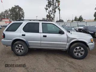 2001 Isuzu Rodeo S with VIN 4S2CK58W614361048, listed as a IAAI auction lot 41681566 with 133,460 mi miles and . Bid and sale history available at DreamBid. Image 13.