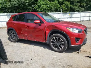 2016 Mazda CX-5 Grand Touring z VIN JM3KE2DY0G0722334, wystawiony jako Copart lot #59998185 z przebiegiem 51 449 mil mil oraz Szkoda całkowita • Salvage title. Historia ofert i sprzedaży dostępna na DreamBid. Obrazek 4.
