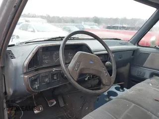 1990 Ford F-150 "S" with VIN 1FTDF15Y4LNB46798, listed as a IAAI auction lot 41767651 with 578,470 mi miles. Bid and sale history available at carsss.com. Image 12.
