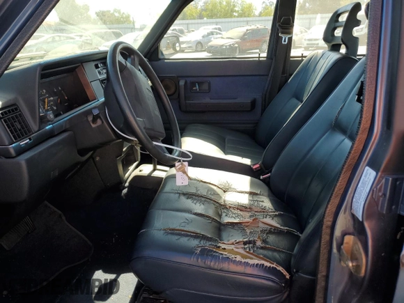 1993 Volvo 240 with VIN YV1AW8311P1955233, listed as a Copart auction lot 76514004 with 216,723 mi miles and Salvage title. Bid and sale history available at DreamBid. Image 7.