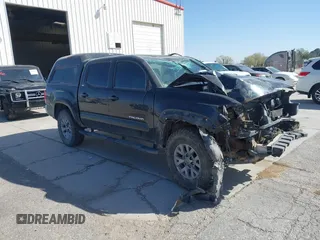 2019 Toyota Tacoma SR with VIN 5TFCZ5AN0KX201398, listed as a IAAI auction lot 41838805 with 90,770 mi miles and . Bid and sale history available at DreamBid. Image 1.