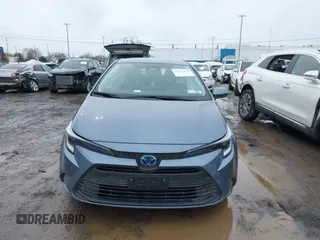 2023 Toyota Corolla Hybrid LE with VIN JTDBDMHE0P3005163, listed as a IAAI auction lot 41631670 with 10,956 mi miles. Bid and sale history available at carsss.com. Image 12.