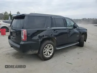 2015 GMC Yukon SLT with VIN 1GKS1BKC1FR615562, listed as a Copart auction lot 46374135 with 141,207 mi miles and Salvage Title. Bid and sale history available at carsss.com. Image 3.