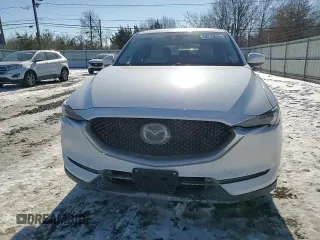 2021 Mazda CX-5 Grand Touring with VIN JM3KFBDM3M1305807, listed as a Copart auction lot 42713655 with 58,162 mi miles and Salvage Title. Bid and sale history available at DreamBid. Image 11.