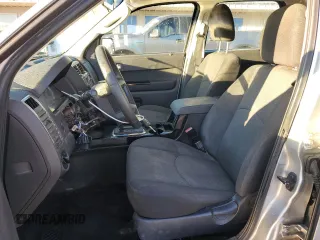 2010 Mazda Tribute Grand Touring with VIN 4F2CY0C74AKM03659, listed as a Copart auction lot 84494254 with 160,177 mi miles and Salvage Title. Bid and sale history available at carsss.com. Image 7.