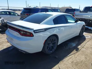 2020 Dodge Charger SXT with VIN 2C3CDXBG9LH136457, listed as a IAAI auction lot 41585590 with 61,390 mi miles and . Bid and sale history available at DreamBid. Image 4.