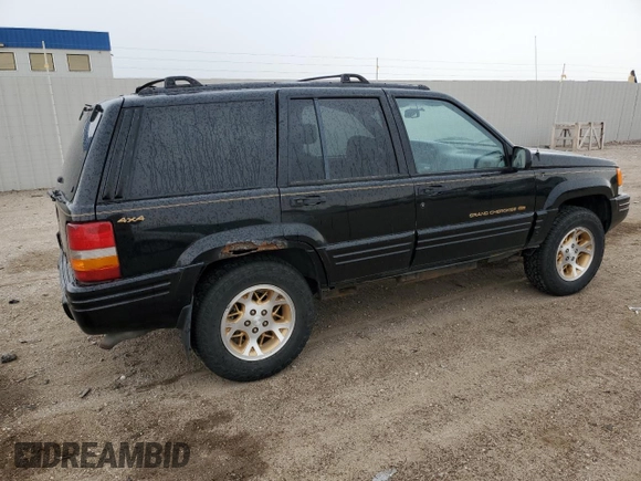 1997 Jeep Grand Cherokee Limited z VIN 1J4GZ78Y8VC586034, wystawiony jako Copart lot #58061705 z przebiegiem 244 355 mil mil oraz Czysty tytuł • Clean title. Historia ofert i sprzedaży dostępna na DreamBid. Obrazek 3.