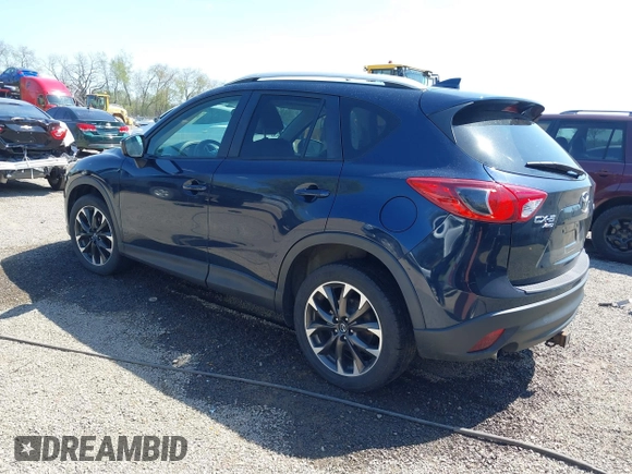 2016 Mazda CX-5 Grand Touring with VIN JM3KE4DY5G0681369, listed as a IAAI auction lot 42102805 with 128,182 mi miles and . Bid and sale history available at DreamBid. Image 3.