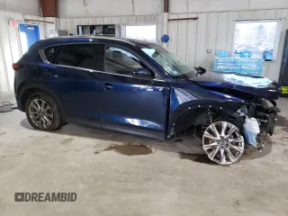 2021 Mazda CX-5 Grand Touring with VIN JM3KFBDM3M0327635, listed as a Copart auction lot 49980635 with 47,160 mi miles and Salvage Title. Bid and sale history available at carsss.com. Image 4.