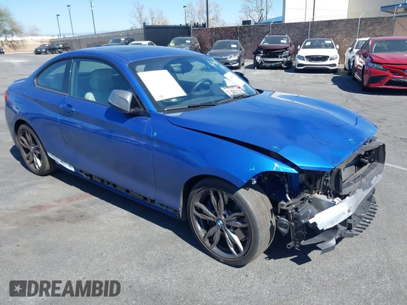 2015 BMW 2 Series M235i with VIN WBA1J7C59FV254140, listed as a IAAI auction lot 41642427 with 23,957 mi miles and . Bid and sale history available at carsss.com. Image 1.