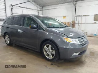2013 Honda Odyssey Touring with VIN 5FNRL5H92DB028646, listed as a IAAI auction lot 42214833 with 172,000 mi miles and . Bid and sale history available at carsss.com. Image 1.