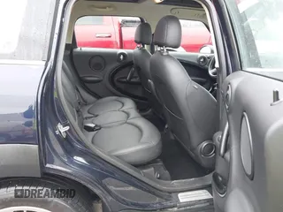 2013 MINI Countryman S ALL4 z VIN WMWZC5C51DWM15816, wystawiony jako IAAI lot #41734311 z przebiegiem 134 636 mil mil oraz . Historia ofert i sprzedaży dostępna na DreamBid. Obrazek 8.