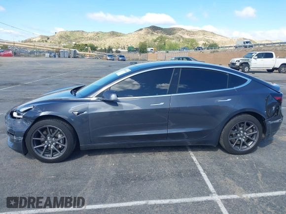 2019 Tesla Model 3 Mid Range with VIN 5YJ3E1EA6KF307456, listed as a IAAI auction lot 41944454 with 99,059 mi miles and . Bid and sale history available at DreamBid. Image 13.