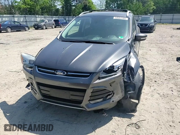 2015 Ford Escape Titanium with VIN 1FMCU9J92FUC74879, listed as a Copart auction lot 54683185 with 143,436 mi miles and Salvage title. Bid and sale history available at DreamBid. Image 14.